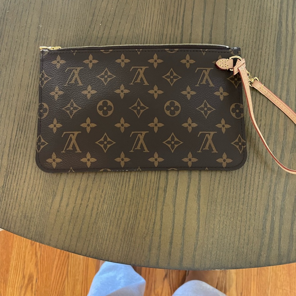 Louis Vuitton Brown Clutch with Iconic Monogram Design and Leather Strap